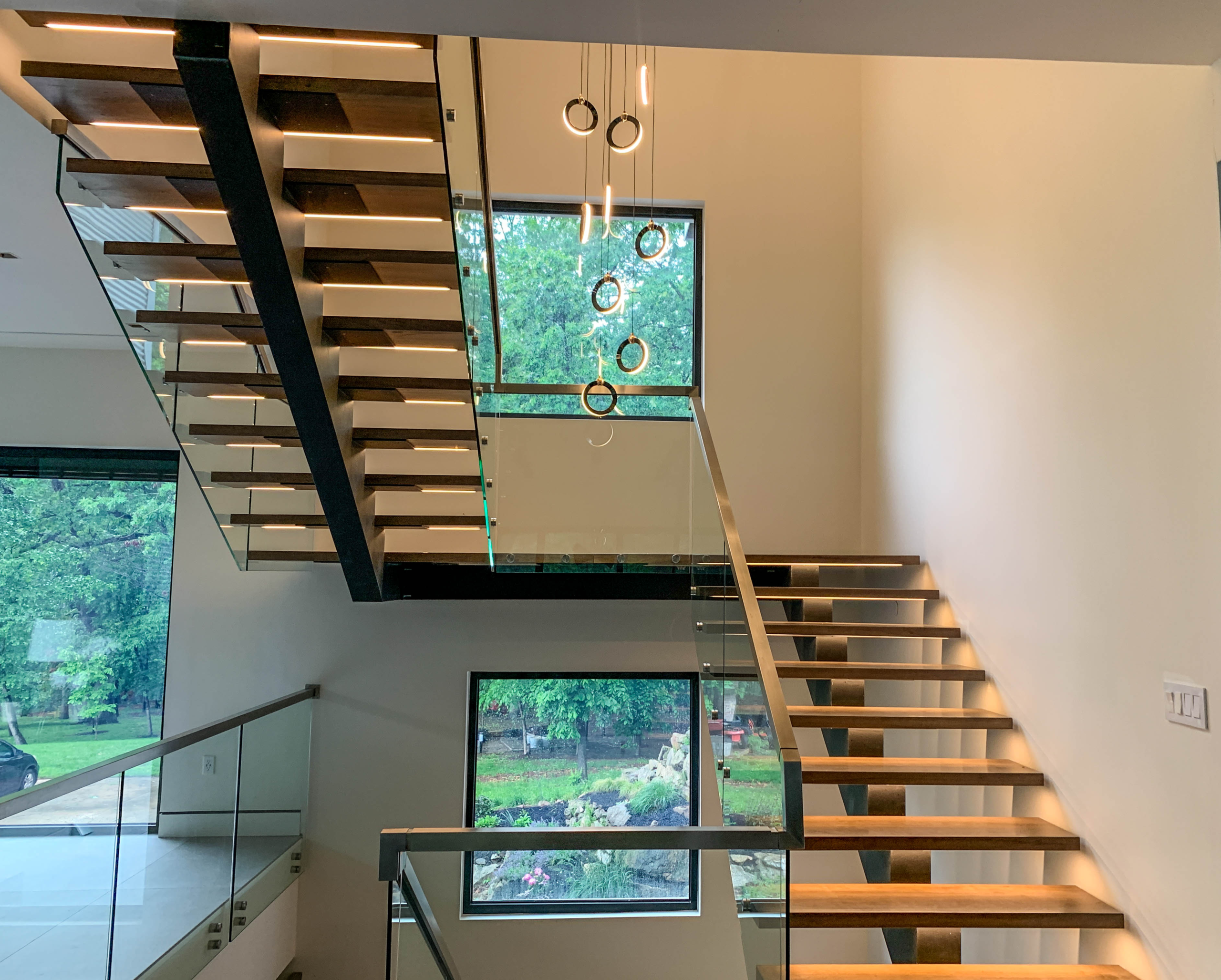 New construction staircase with skylight by TASH Construction and Remodeling