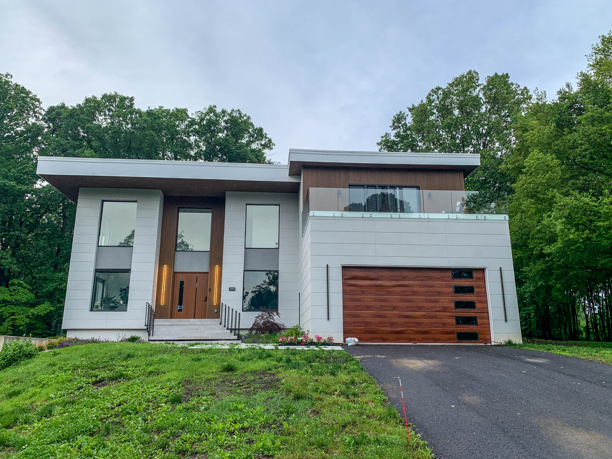Modern home exterior construction project by TASH Construction and Remodeling